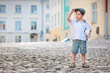 Portrait of a little 3 years old boy outdoors clipart