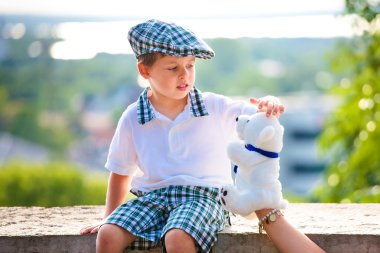 Cute little boy playing with toy clipart