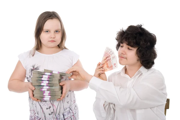 Boy takes away a batch of money from girl — Stock Photo, Image
