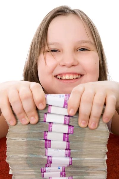 Cheerful girl and pile of money — Stock Photo, Image