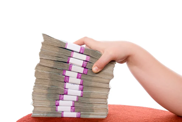 Hand and pile of money — Stock Photo, Image