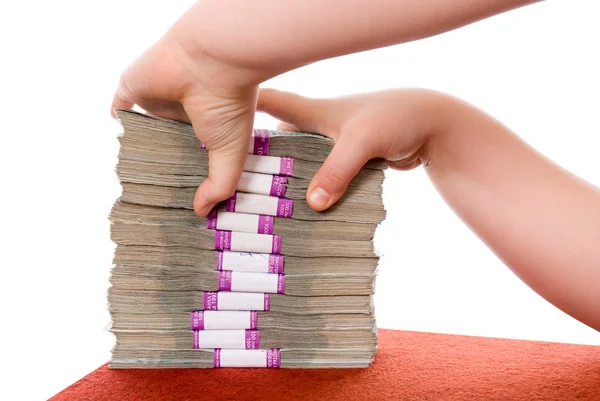 Mão e pilha de dinheiro — Fotografia de Stock