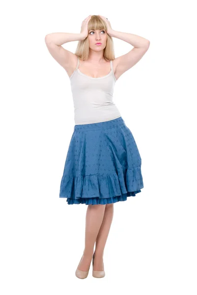 Beautiful emotional blonde in a dark blue skirt — Stock Photo, Image