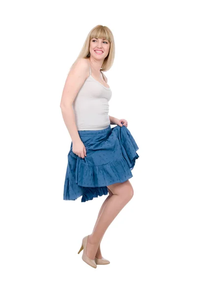 Beautiful emotional blonde in a dark blue skirt Stock Image