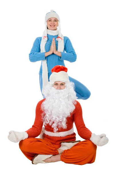 Weihnachtsmann und die Schneemädchen des Yoga — Stockfoto