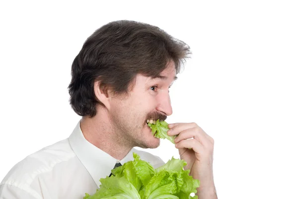 Άνθρωπος τρώει φύλλο τη σαλάτα — Φωτογραφία Αρχείου