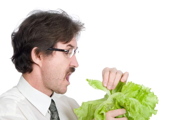 Άνθρωπος τρώει φύλλο τη σαλάτα — Φωτογραφία Αρχείου