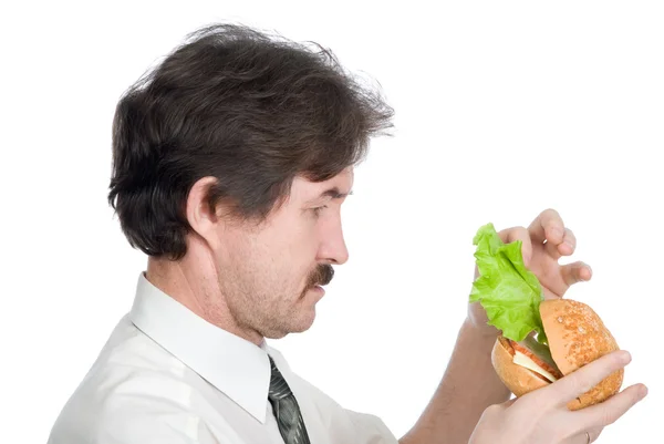 Man will get from hamburger sheet salad — Stock Photo, Image