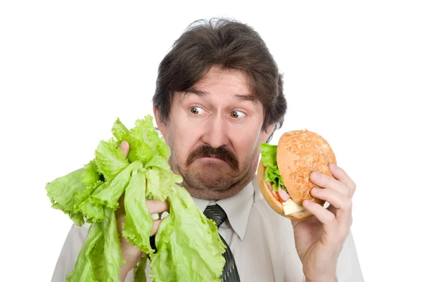 Escolha da salada de homem de negócios ou hambúrguer — Fotografia de Stock