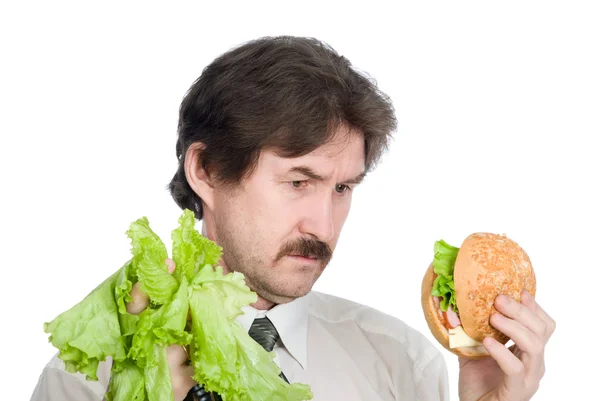 Wahl zwischen Geschäftsmann-Salat oder Hamburger — Stockfoto
