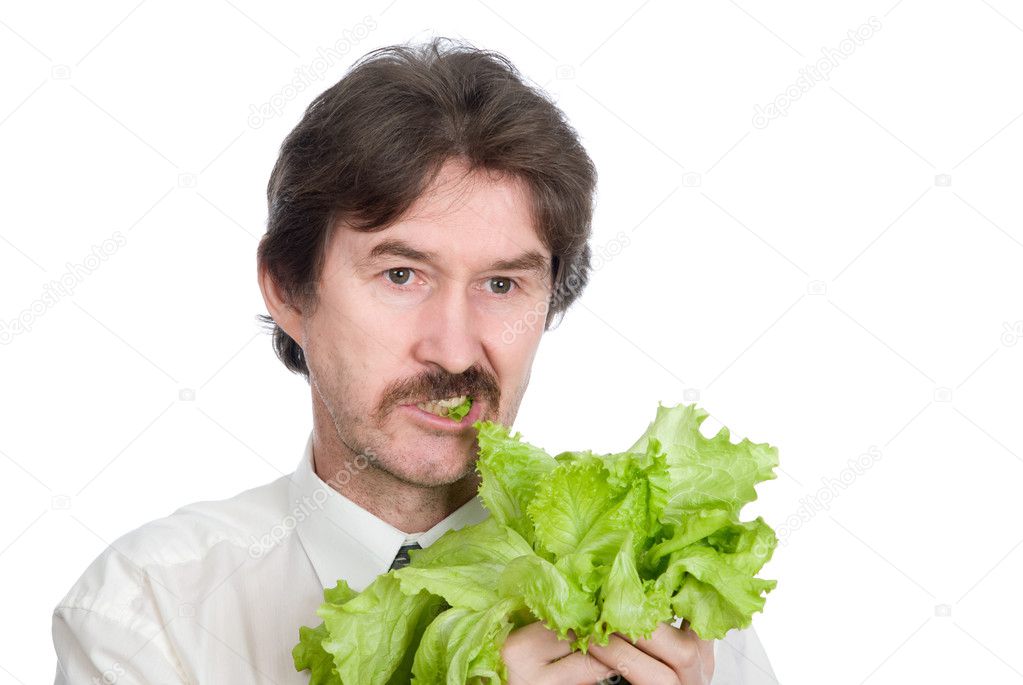 Man eats sheet of the salad