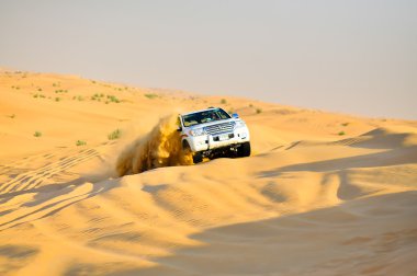 Safari car in yellow desert ,exploison of sand clipart