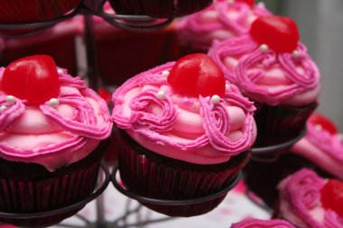 Pink Frosted Chocolate Cupcakes clipart