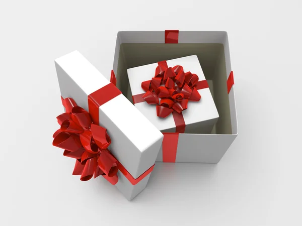 Witte geopende geschenkdoos met rood lint en kleinere doos binnen — Stockfoto