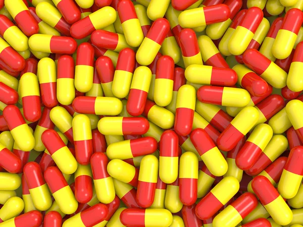 Red and yellow pills background — Stock Photo, Image
