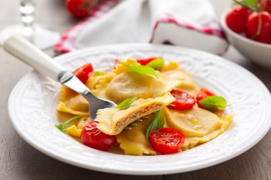 Ravioli with tomatoes and basil clipart