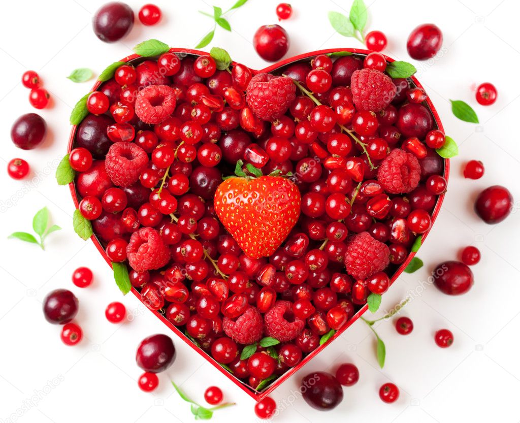 Red berries in heart-shaped box