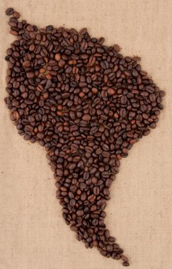 Coffee beans are laid out on the bag in the shape of South Ameri clipart