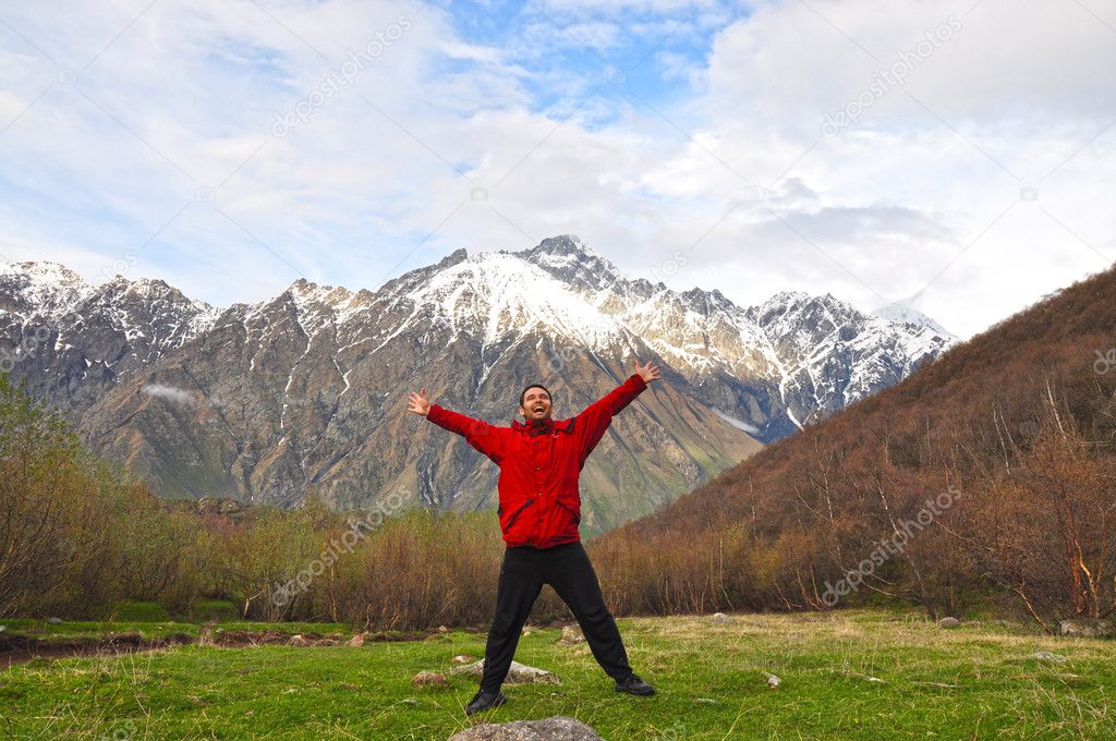 Joyful man in the mountains