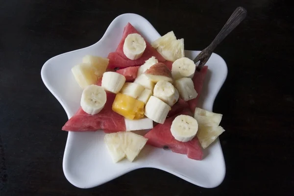 stock image Seasons fruits on the white stars plate