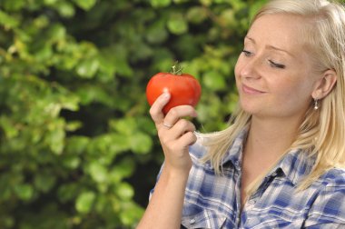 Woman with tomato. clipart