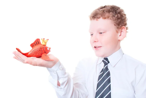 Boy holding a goldfish out of plasticine — Stock Photo, Image