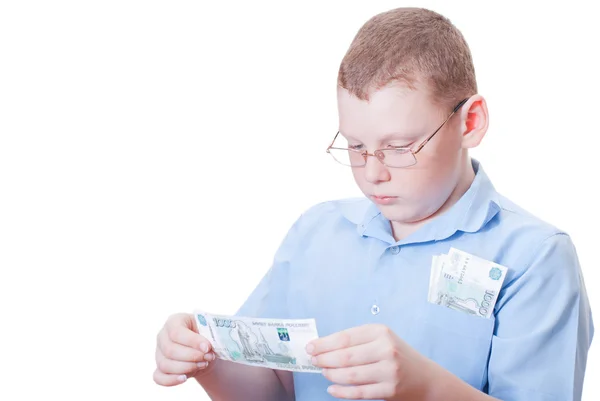 The boy looks at the bill — Stock Photo, Image