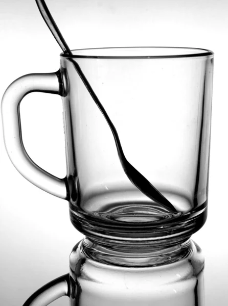 Glass from the glass with a handle and a spoon inside the — Stock Photo, Image