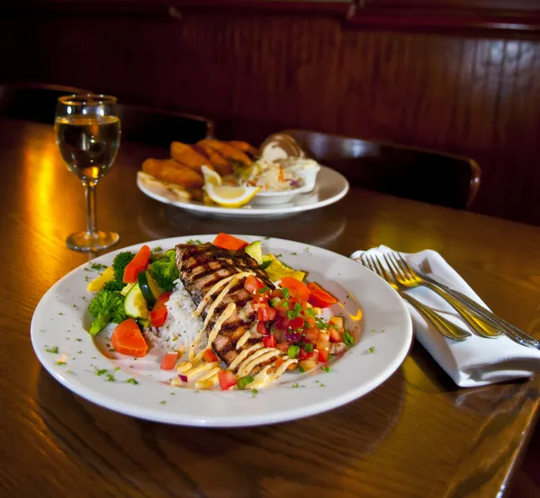 stock image Grilled Fish and glass of wine