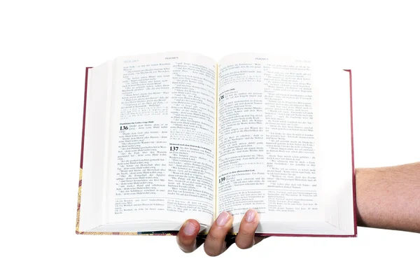 La main priante tient une bible ouverte — Photo