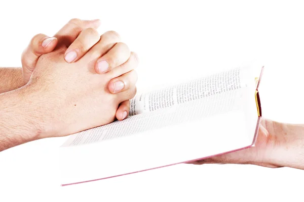 Orando de la mano sostiene una biblia abierta Fotos de stock libres de derechos