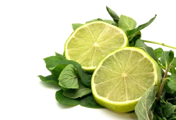 Lime wedges with mint leaves — Stock Photo, Image