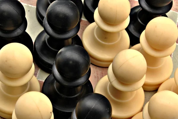Several pawns black and white — Stock Photo, Image