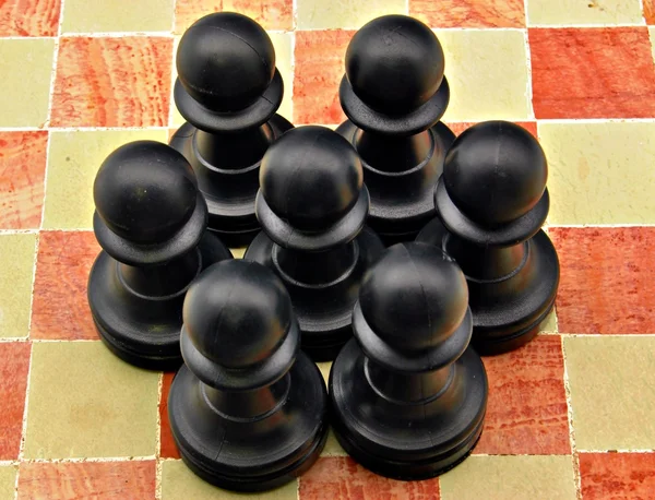 Several pawns black — Stock Photo, Image