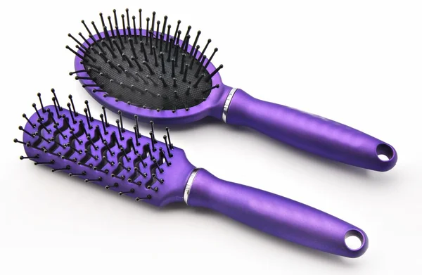 Spazzole capelli viola — Foto Stock