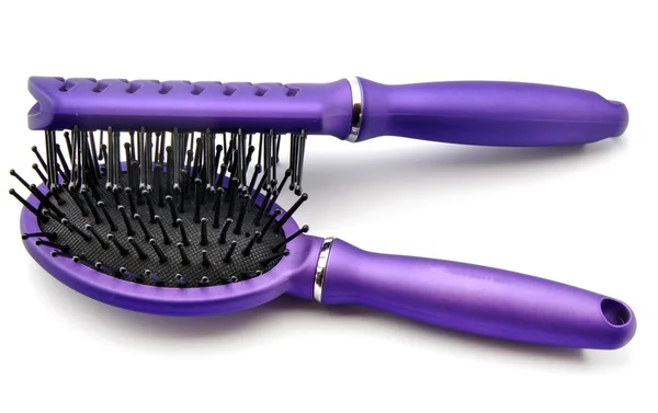 Spazzole capelli viola — Foto Stock