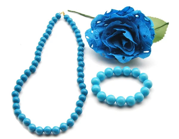 Bracelet and blue flowers — Stock Photo, Image