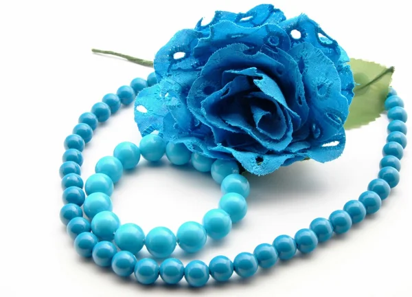 Bracelet and blue flowers — Stock Photo, Image