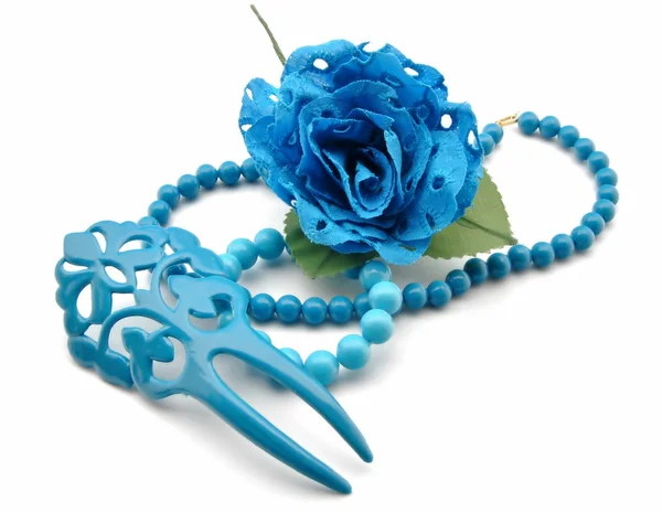 Comb, bracelet and blue flowers — Stock Photo, Image