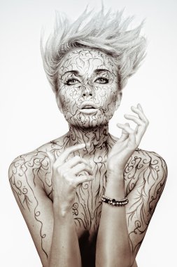 Beautiful girl with a creative hairdress and bodyart clipart