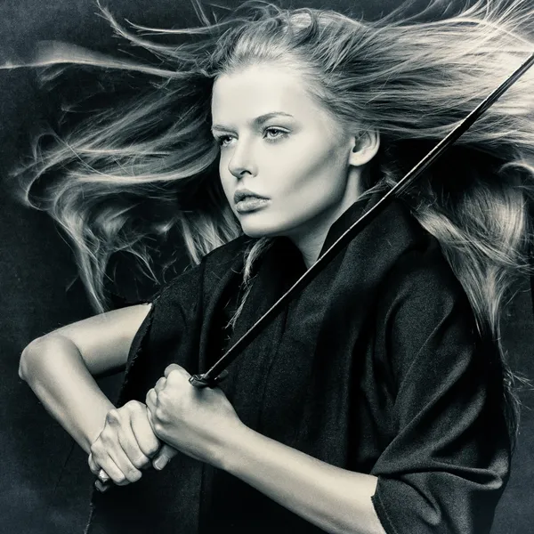 Closeup of beautiful girl with sword. — Stock Photo, Image