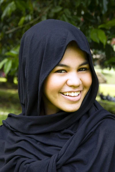 stock image Indonesian girl in the park smiling