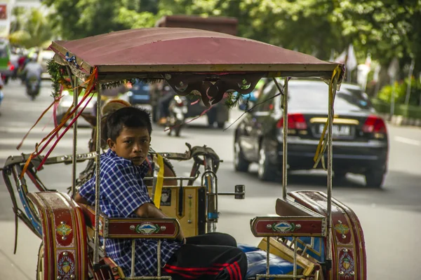 Stock image Indonesian coachman boy