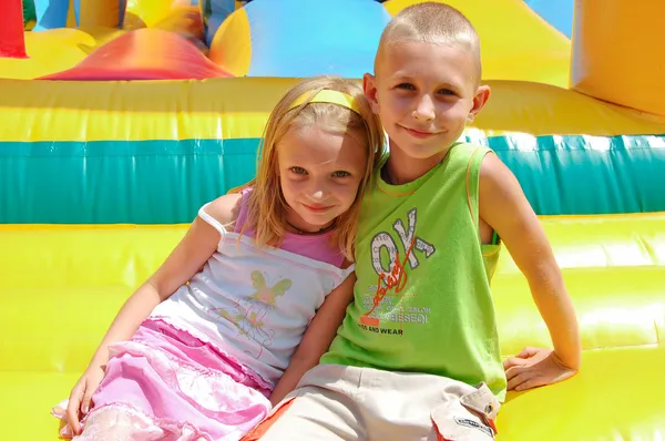 stock image The girl and the boy in park of attractions