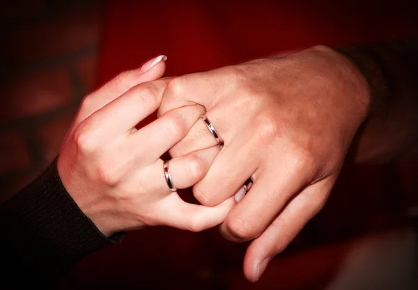 stock image Hands with wedding rings hold each other