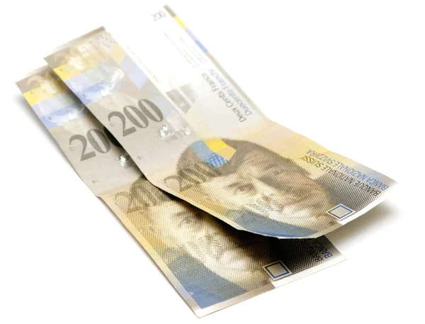 Schweiziska francs på vit — Stockfoto