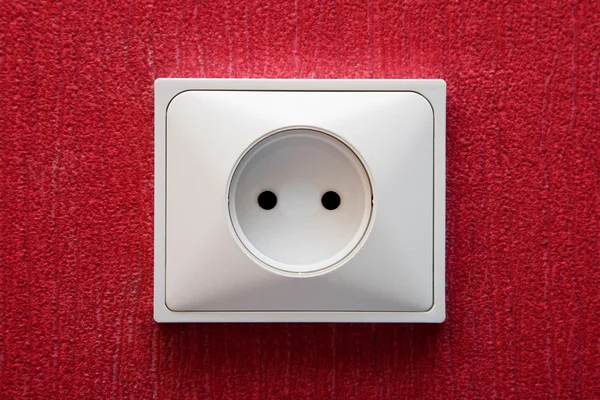 The socket in a red wall — Stock Photo, Image