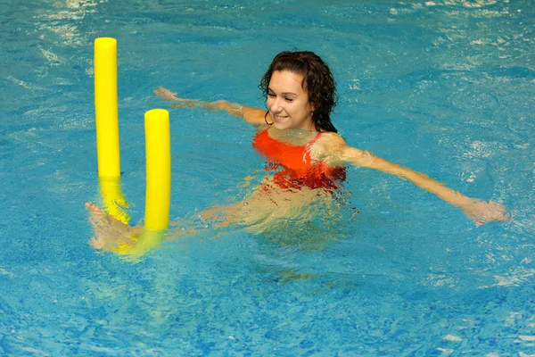 The woman does exercise in water — Stock Photo, Image