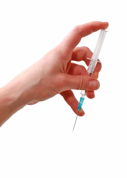 Syringe in a hand — Stock Photo, Image