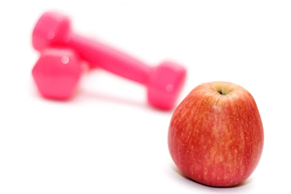 Činky a apple na bílé, fitness — Stock fotografie